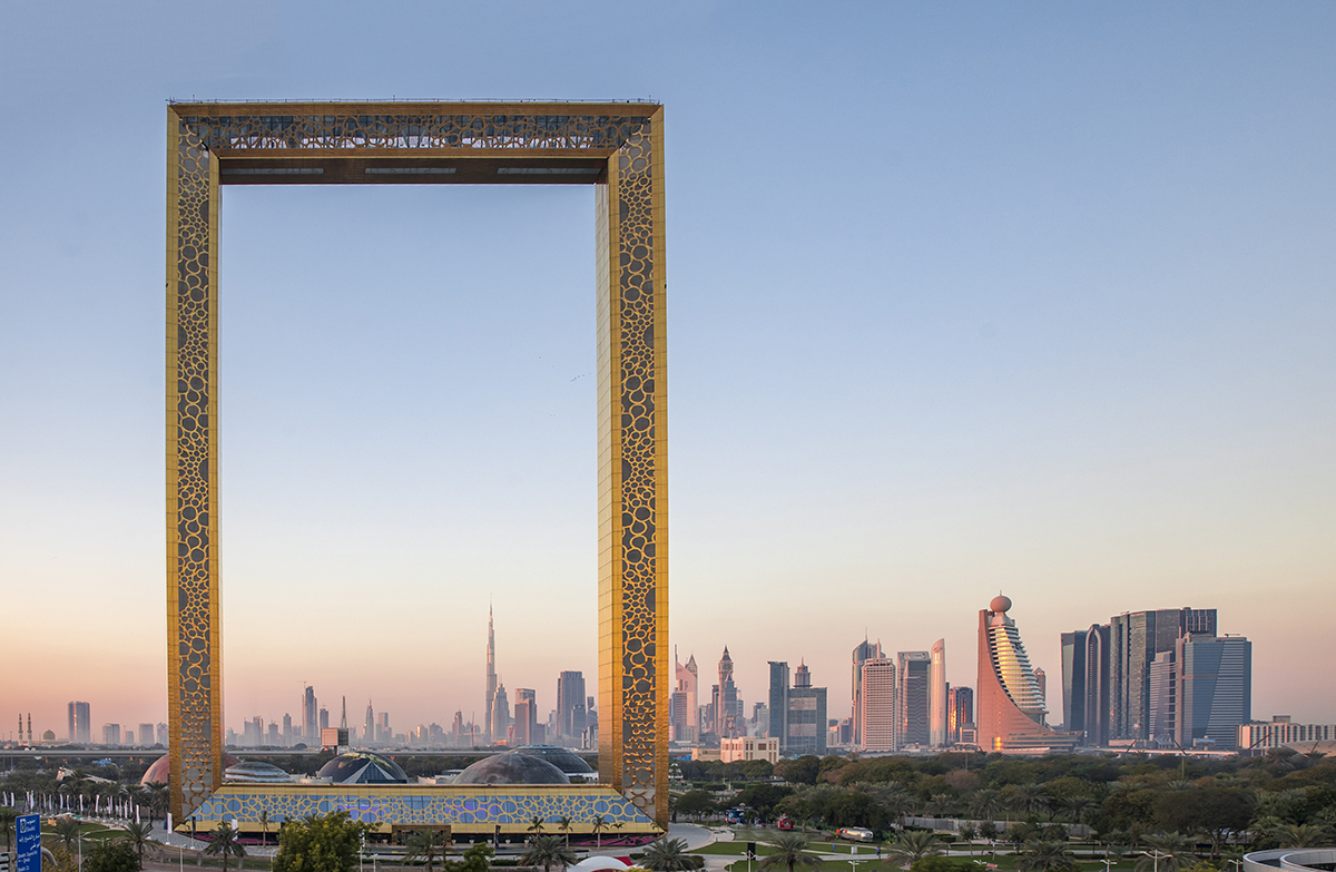 Dubai frame and the cityscape at sunset