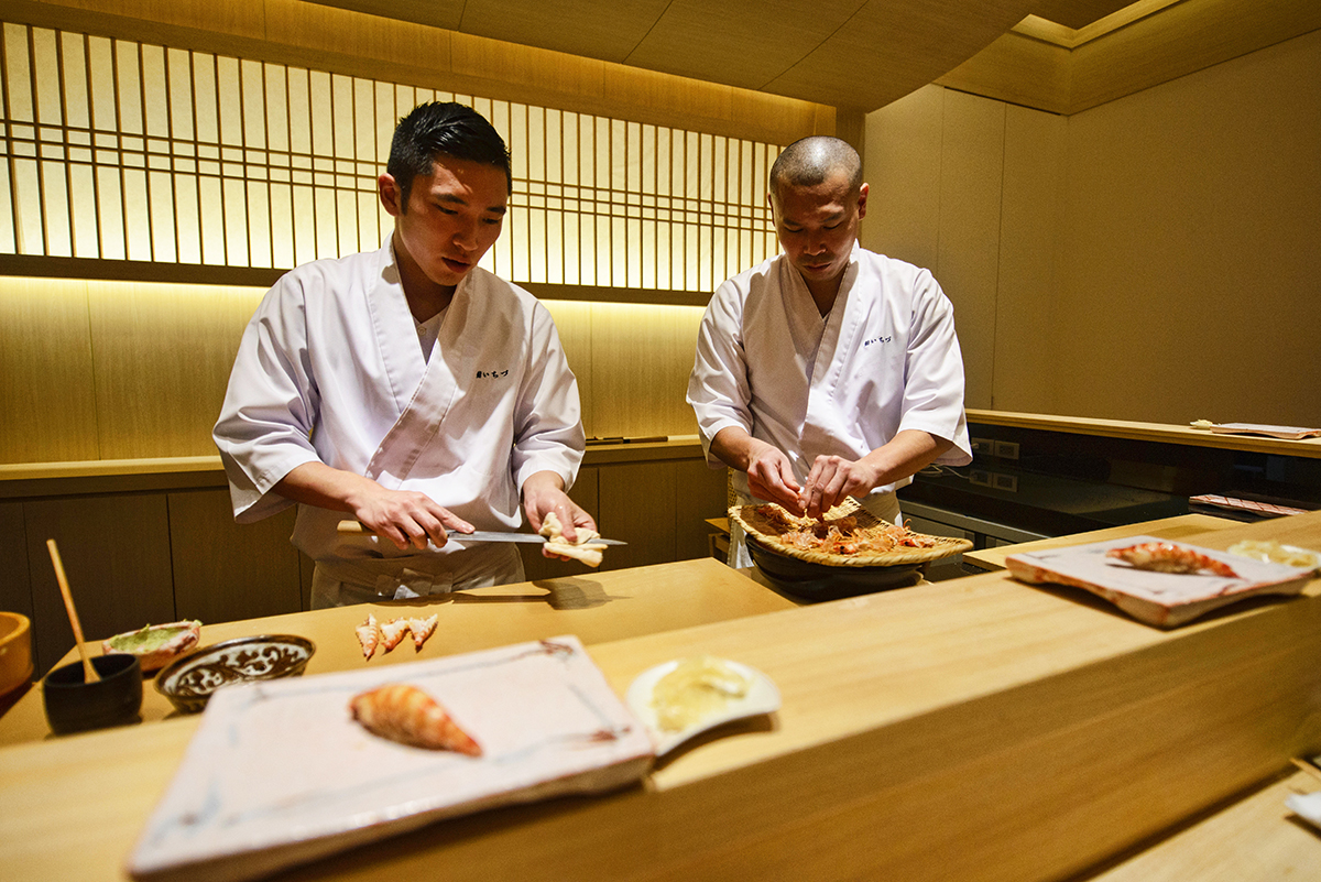 Chef preparing Ebi shrimp sushi at an omakase sushi restaurant